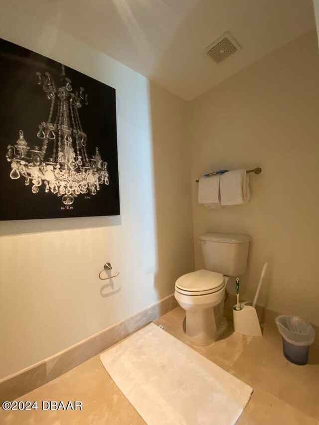 bathroom featuring tile patterned flooring and toilet