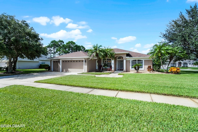 single story home featuring a garage and a front yard