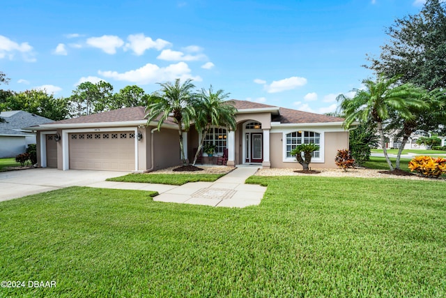 view of front facade with a garage and a front lawn