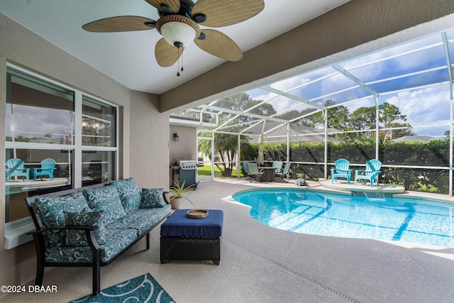 view of swimming pool with a patio area, glass enclosure, ceiling fan, area for grilling, and an outdoor living space