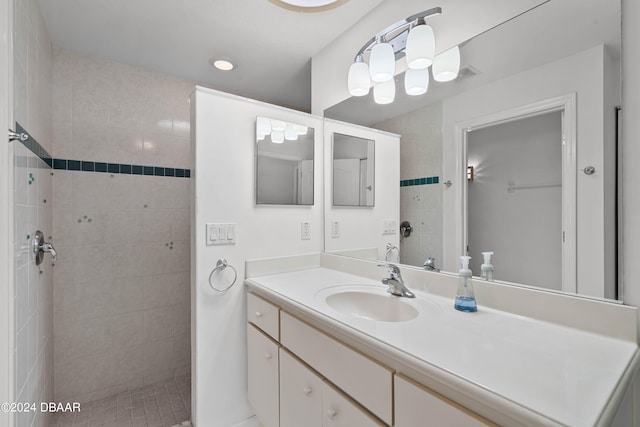 bathroom featuring vanity and a tile shower