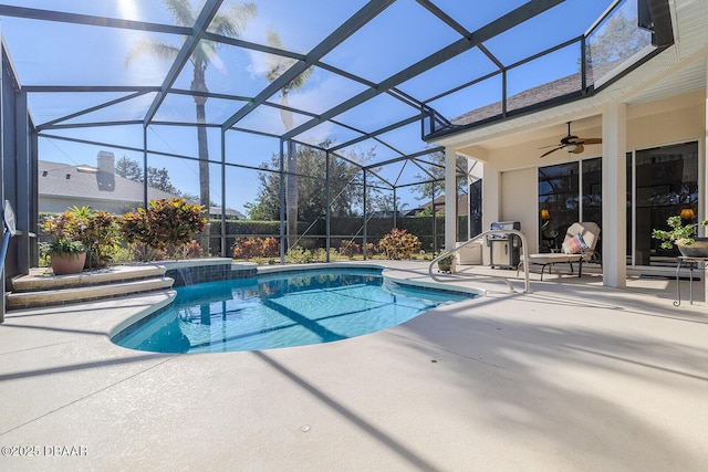 view of swimming pool featuring a patio area, a lanai, and ceiling fan