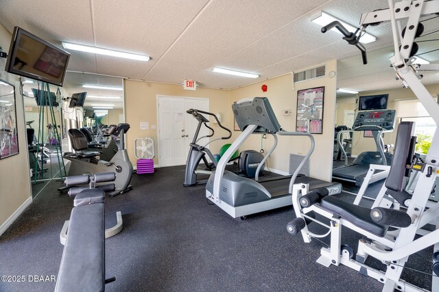 gym featuring baseboards
