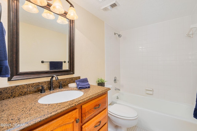 bathroom with toilet, vanity, and washtub / shower combination