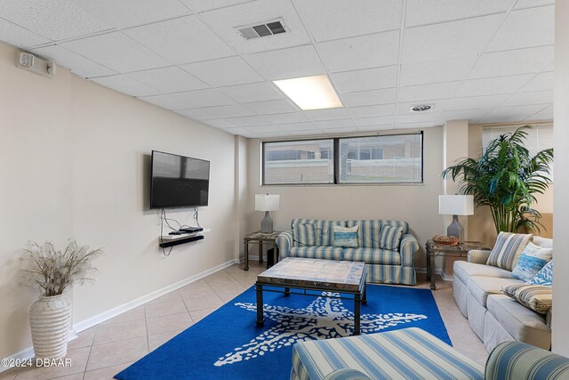 carpeted living room featuring a chandelier and a textured ceiling