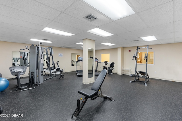 exercise room featuring a paneled ceiling