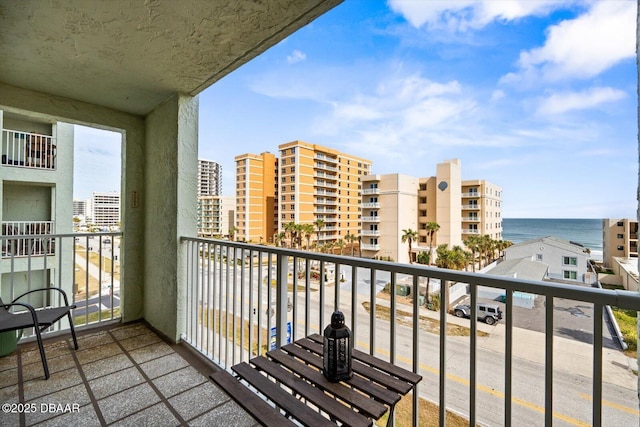 balcony featuring a water view