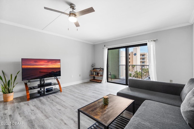 living room featuring ceiling fan, crown molding, and hardwood / wood-style flooring