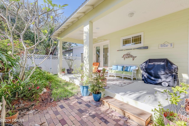 view of patio / terrace with grilling area, french doors, and an outdoor hangout area