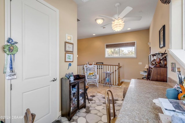 interior space featuring ceiling fan and a nursery area