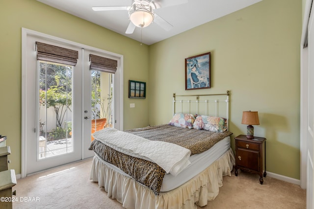 carpeted bedroom featuring access to exterior and ceiling fan