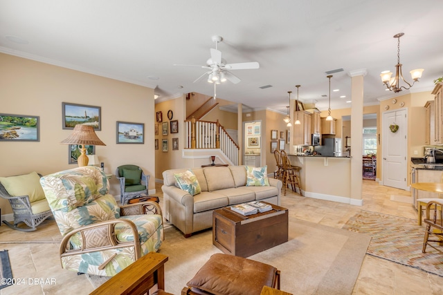 living room with ceiling fan with notable chandelier and crown molding