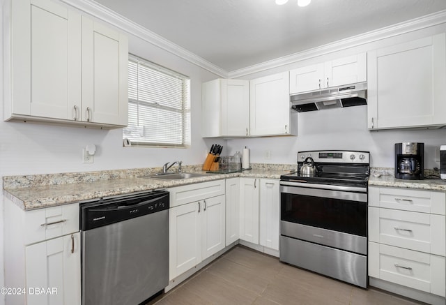 kitchen featuring crown molding, white cabinetry, sink, and appliances with stainless steel finishes