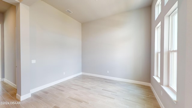 spare room with light wood-type flooring