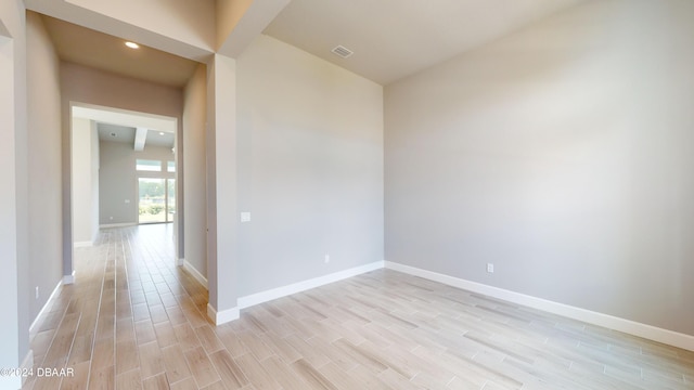 unfurnished room with light hardwood / wood-style flooring