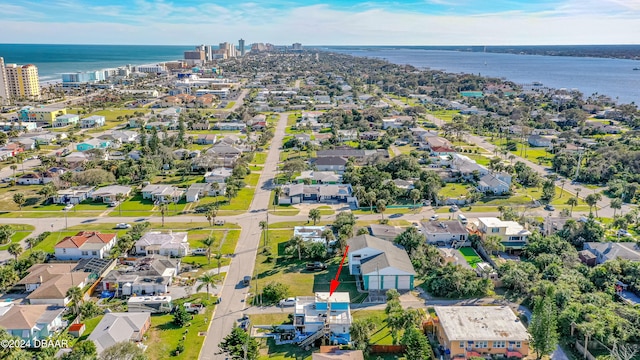 birds eye view of property with a water view