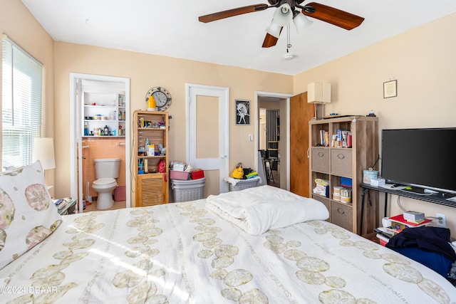 bedroom featuring ensuite bath and ceiling fan