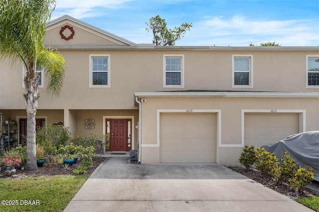 1615 Primo Ct, Holly Hill, FL 32117 - view of property featuring driveway, a garage, and stucco siding