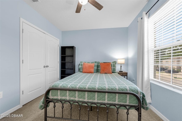 1615 Primo Ct, Holly Hill, FL 32117 - carpeted bedroom with baseboards, a ceiling fan, and a closet