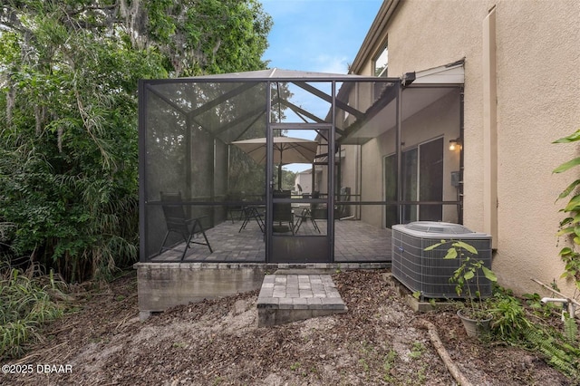 1615 Primo Ct, Holly Hill, FL 32117 - view of patio featuring cooling unit and glass enclosure