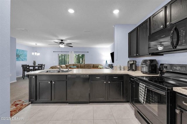 1615 Primo Ct, Holly Hill, FL 32117 - kitchen with black appliances, a sink, open floor plan, a ceiling fan, and a peninsula