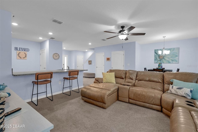 1615 Primo Ct, Holly Hill, FL 32117 - living room with carpet flooring, a ceiling fan, a chandelier, recessed lighting, and baseboards