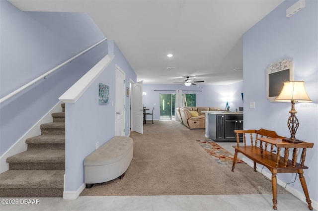 1615 Primo Ct, Holly Hill, FL 32117 - living area featuring a ceiling fan, stairway, light carpet, baseboards, and recessed lighting