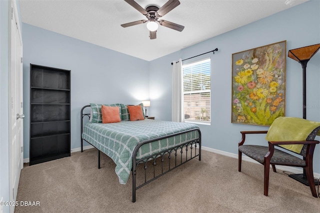1615 Primo Ct, Holly Hill, FL 32117 - bedroom with carpet flooring, baseboards, and a ceiling fan