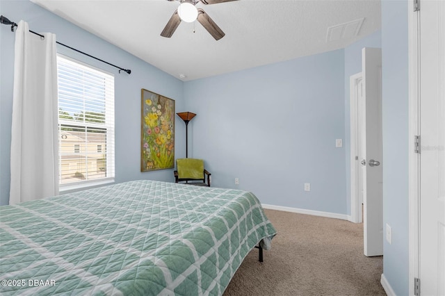 1615 Primo Ct, Holly Hill, FL 32117 - bedroom with carpet flooring, baseboards, and ceiling fan