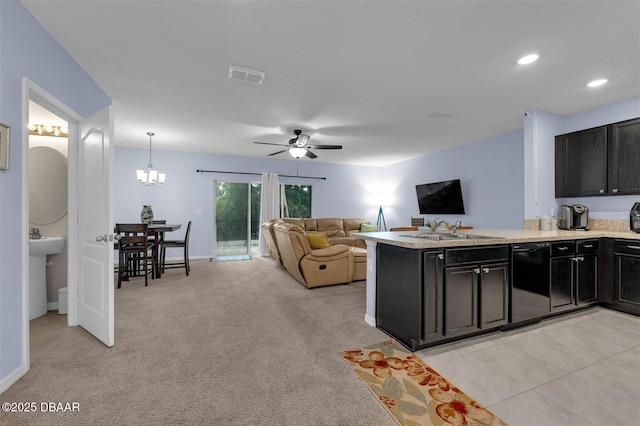 1615 Primo Ct, Holly Hill, FL 32117 - kitchen featuring black dishwasher, a sink, dark cabinetry, open floor plan, and recessed lighting