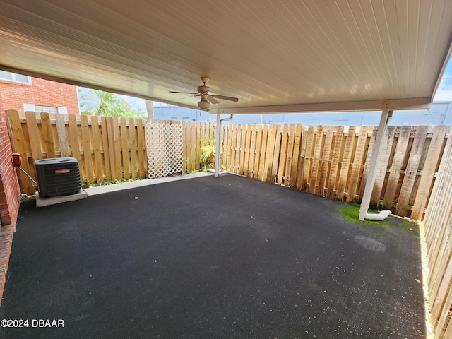 view of patio / terrace with central AC unit, fence, and a ceiling fan