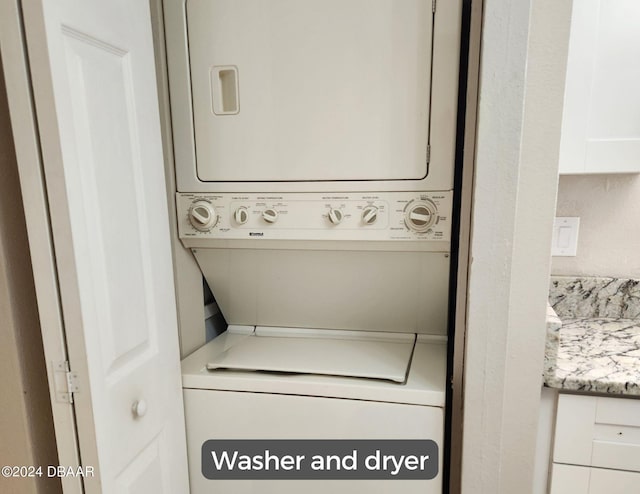 laundry area with laundry area and stacked washing maching and dryer