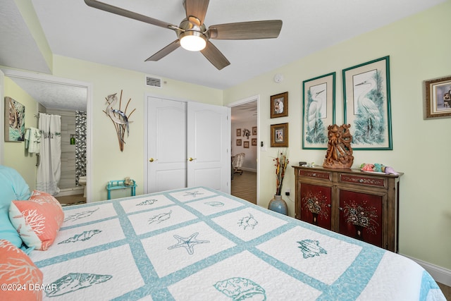 711 N Halifax Ave Unit 405, Daytona Beach, FL 32118 - bedroom with ensuite bath, ceiling fan, and a closet