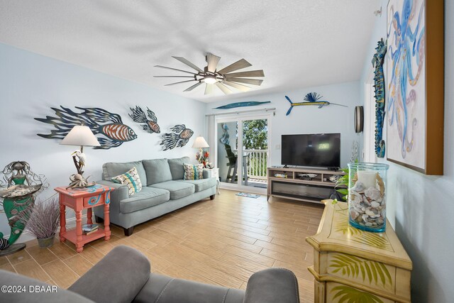 711 N Halifax Ave Unit 405, Daytona Beach, FL 32118 - living room with ceiling fan, a textured ceiling, and light wood-type flooring