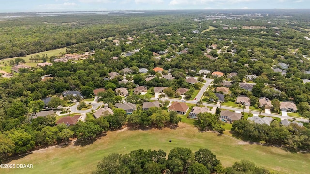 1320 Antrim Cir, Ormond Beach, FL 32174 - drone / aerial view featuring a wooded view