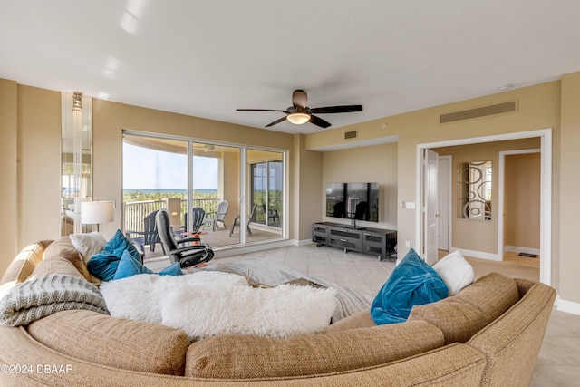 tiled living room with ceiling fan