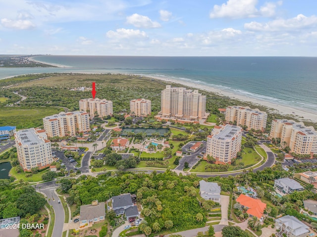 bird's eye view featuring a view of the beach and a water view