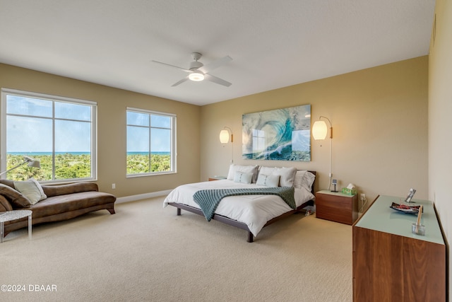 bedroom with light carpet and ceiling fan