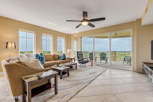 tiled living room with ceiling fan