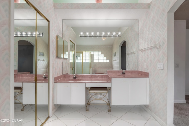 bathroom with tile patterned flooring and vanity