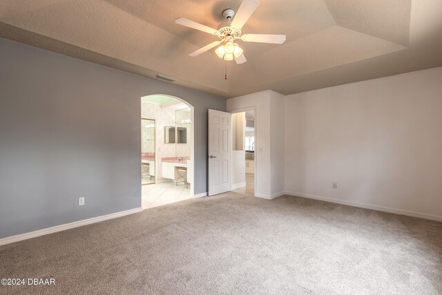 interior space featuring a textured ceiling and ceiling fan