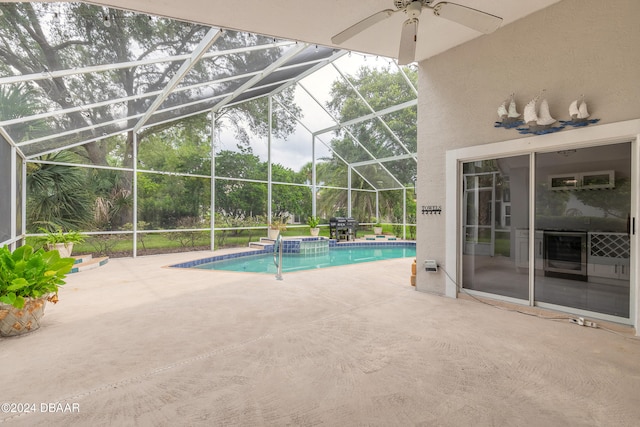 view of pool featuring a lanai, ceiling fan, and a patio