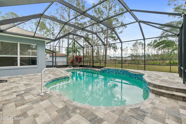 view of swimming pool with a patio and glass enclosure