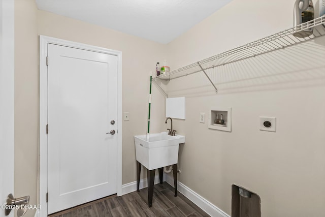 laundry room with dark wood-type flooring, washer hookup, and hookup for an electric dryer