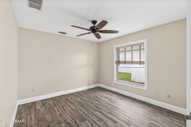 unfurnished room with hardwood / wood-style flooring and ceiling fan