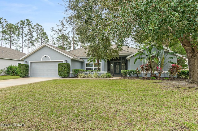 view of front of house featuring a garage and a front yard