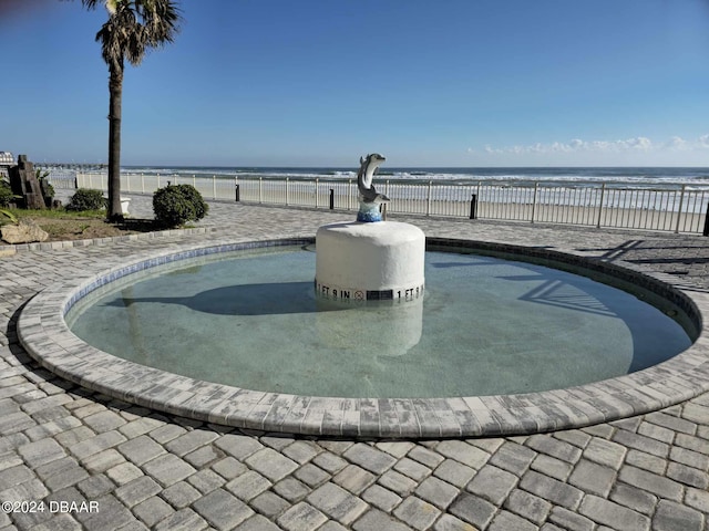 219 S Atlantic Ave Unit 235, Daytona Beach, FL 32118 - view of pool with fence and a water view