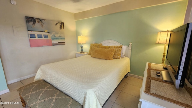 bedroom featuring light tile patterned flooring