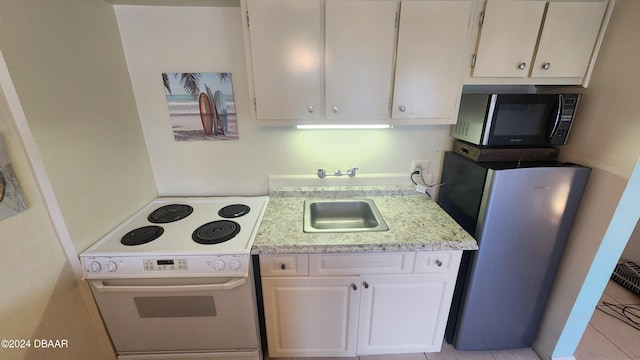 kitchen with white cabinetry, electric stove, stainless steel refrigerator, light tile patterned floors, and sink