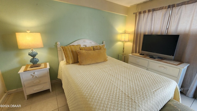 219 S Atlantic Ave Unit 235, Daytona Beach, FL 32118 - bedroom featuring light tile patterned floors and baseboards